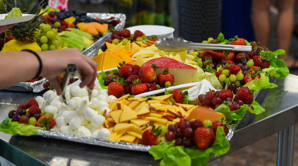 Campers serving themselves from a uffet of food